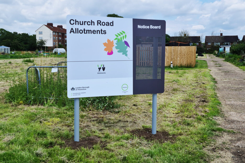 Signs on posts in Aylesbury fitted into soft ground in Allotments