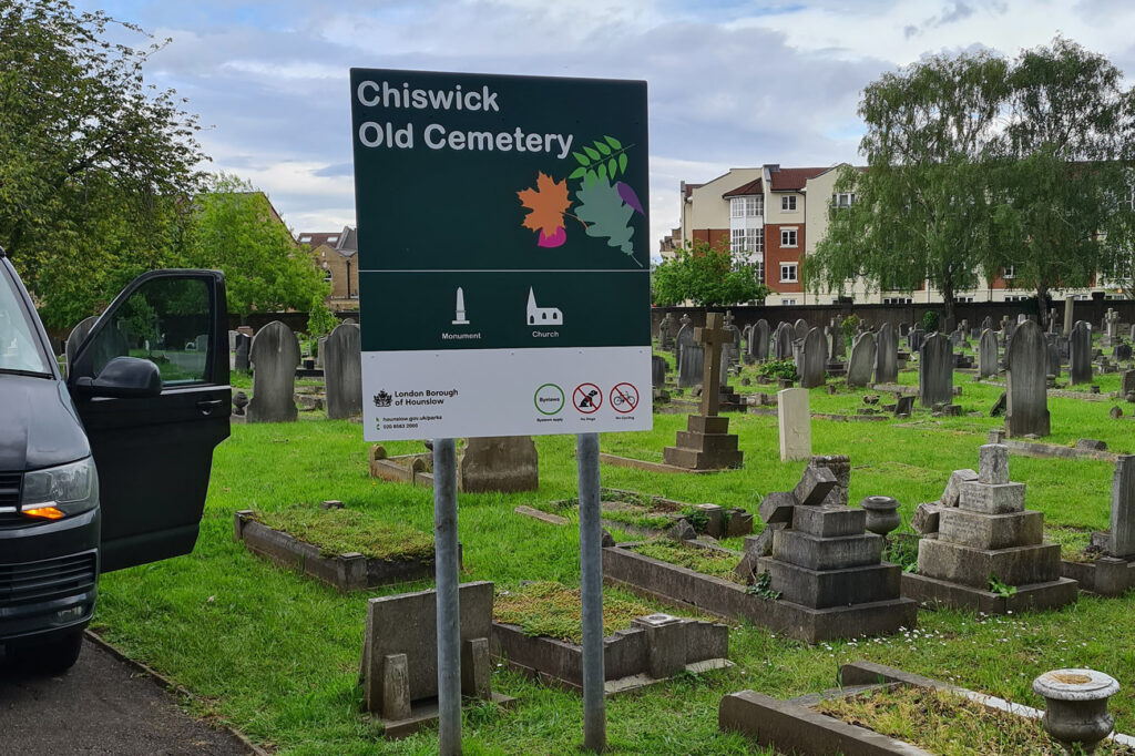 Signs on posts fitted into a cemetary