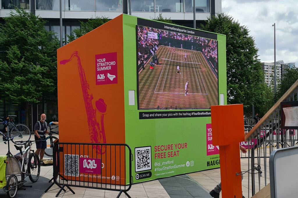 Printed vinyl applied to an outdoor structure for a large TV