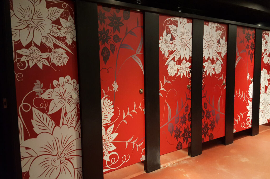 Floral patterned red toilet stall doors