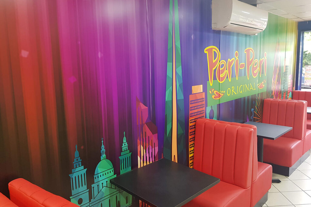Colourful restaurant interior with seating. Printed wallpaper