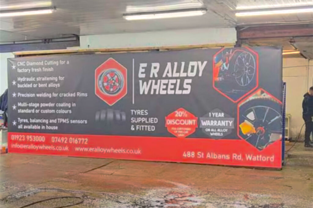 Heavy duty PVC banner advertising alloy wheel services in car wash business