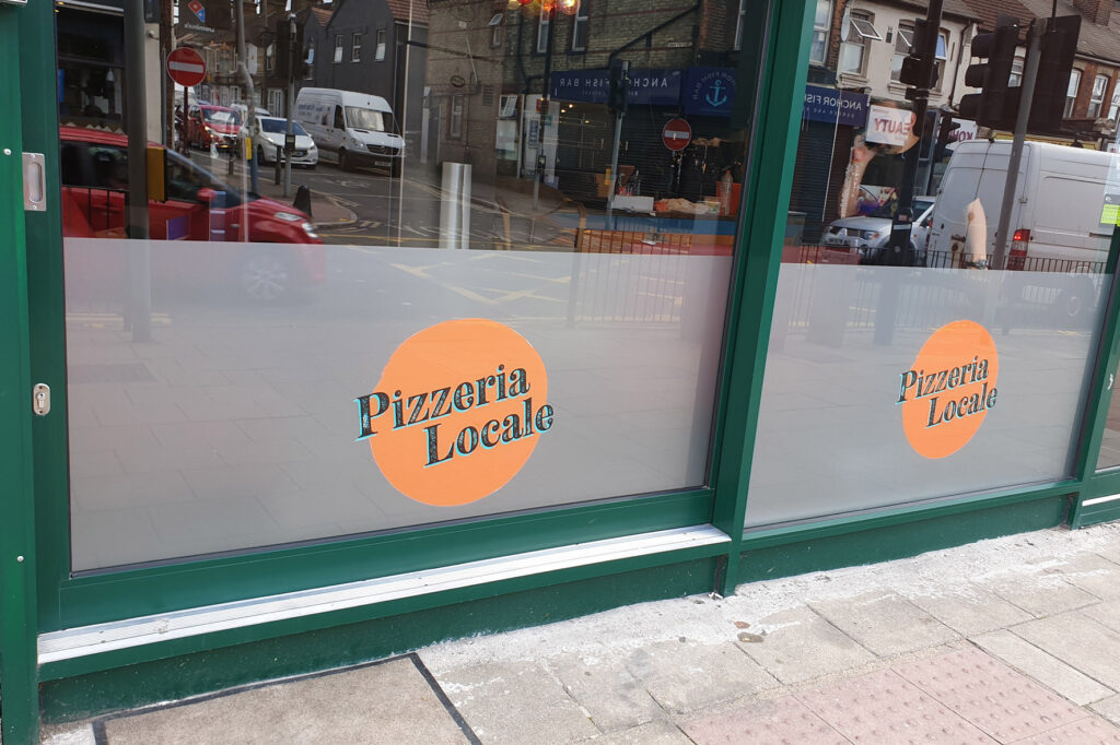 Pizzeria Locale window signage displayed, produced by our sign shop in Aylesbury