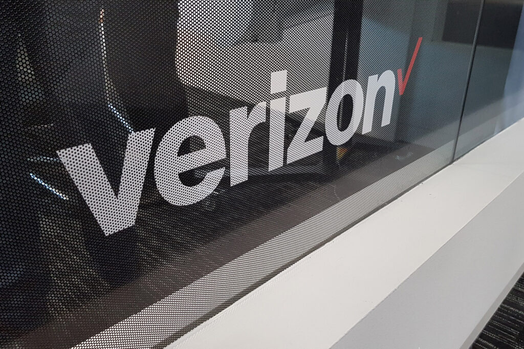 One way vision applied to glass partition in an office for Verizon